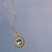 Blue Topaz Gold Framed Oval Pendant Necklace 