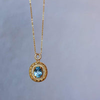 Blue Topaz Gold Framed Oval Pendant Necklace 