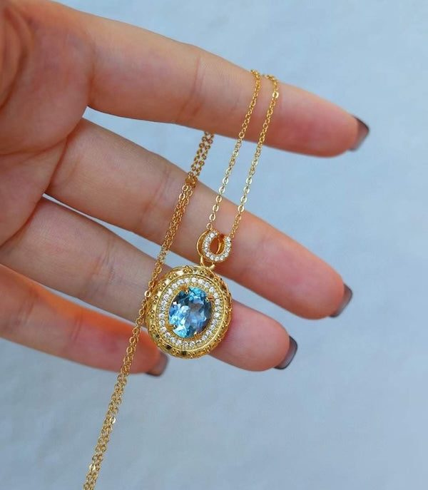 Blue Topaz Gold Framed Oval Pendant Necklace 